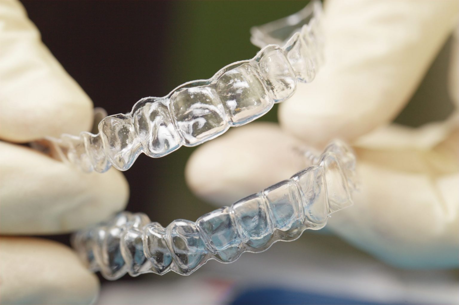 doctors-hands-holding-silicone-mouth-guard-PGUYKJ5-compressed-2048x1364-1