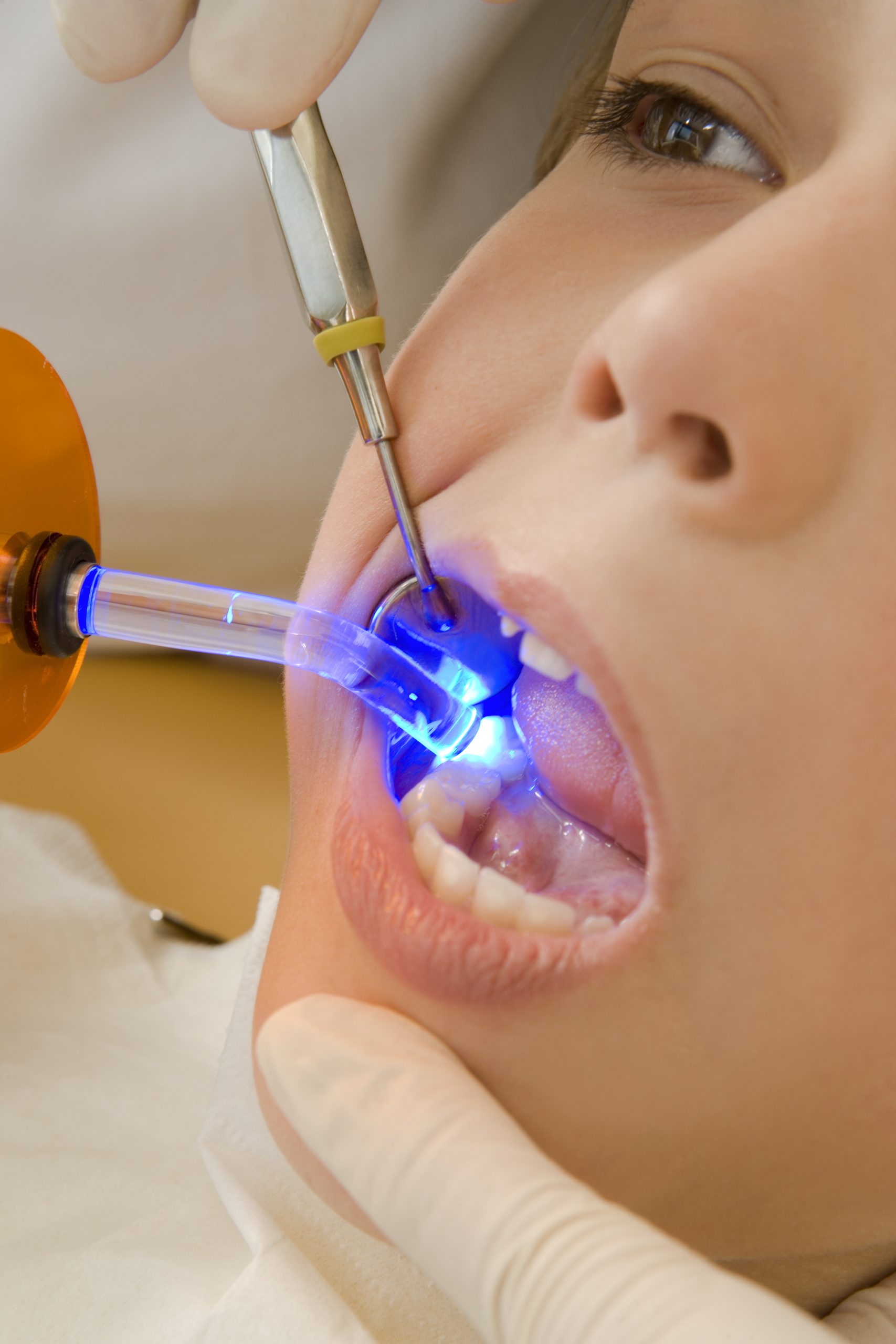 Dentist examining boy’s teeth