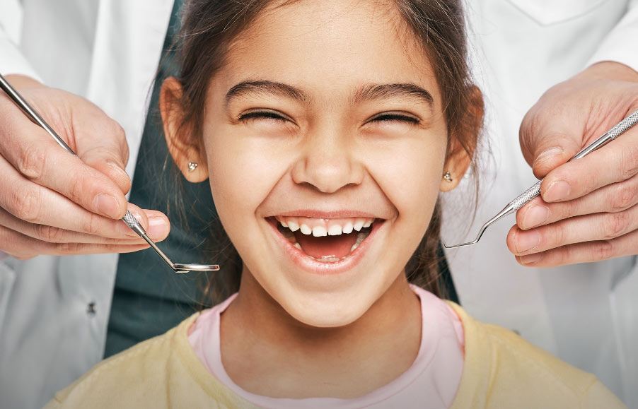 Smiling patient receiving dental care