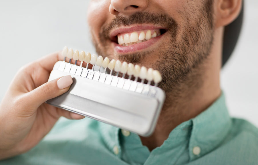 Happy dental patient in clinic