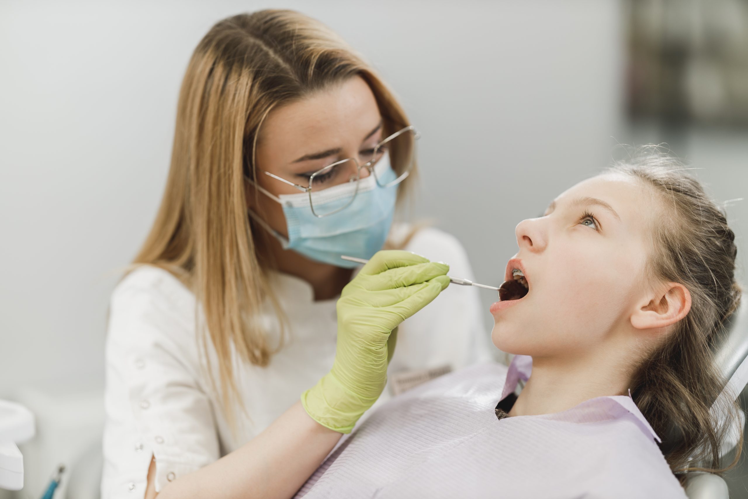 Patient opening mouth wide for dental exam